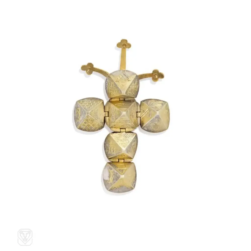 An antique masonic voting ballot pendant which unfolds to reveal mystical symbols, in 9k.