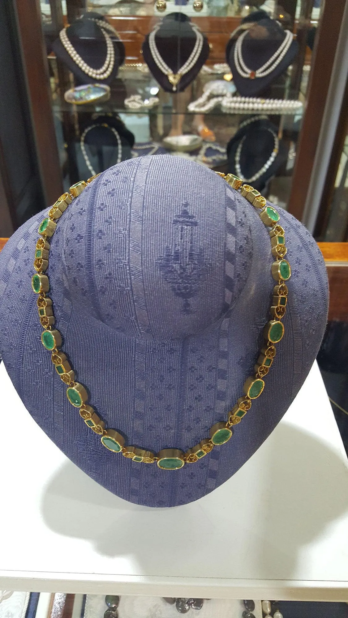 Necklace in 18k gold Perforated with Zambian emeralds