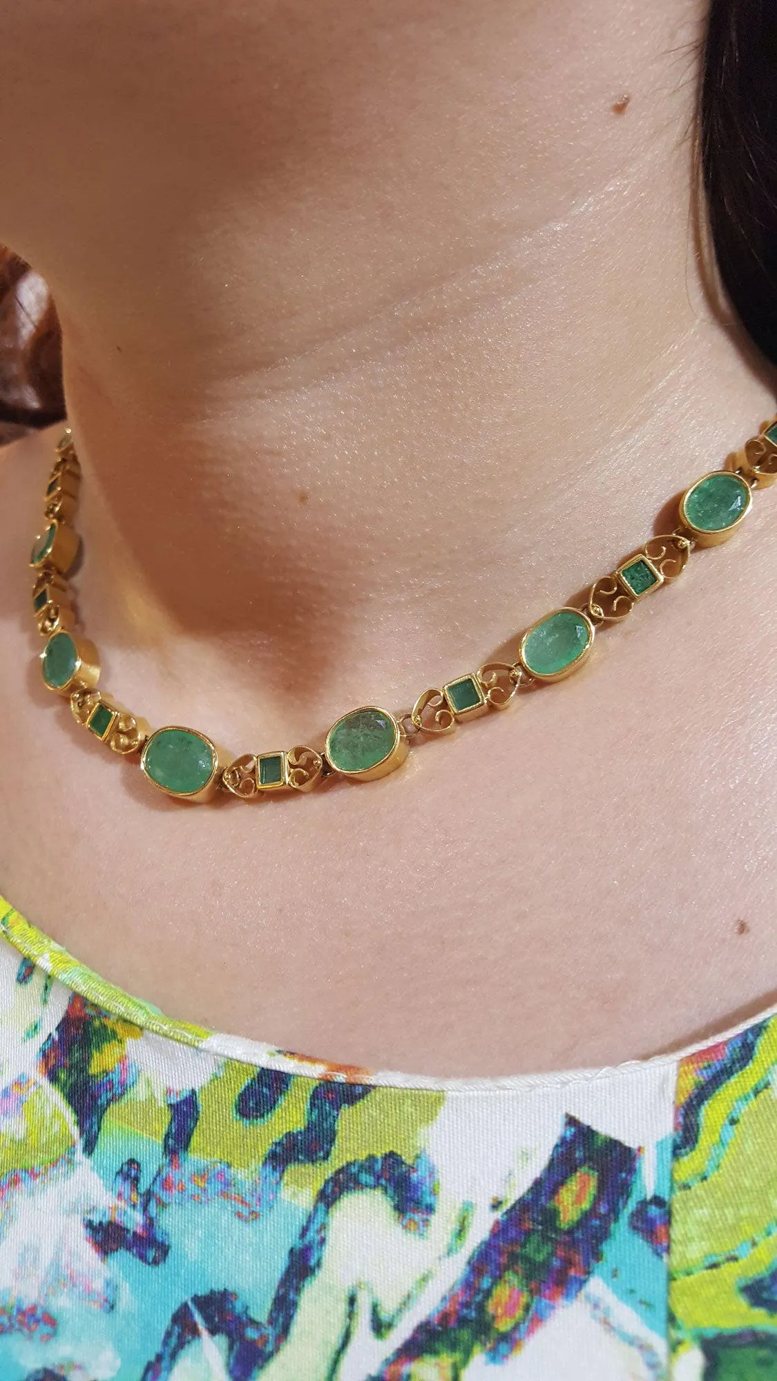 Necklace in 18k gold Perforated with Zambian emeralds