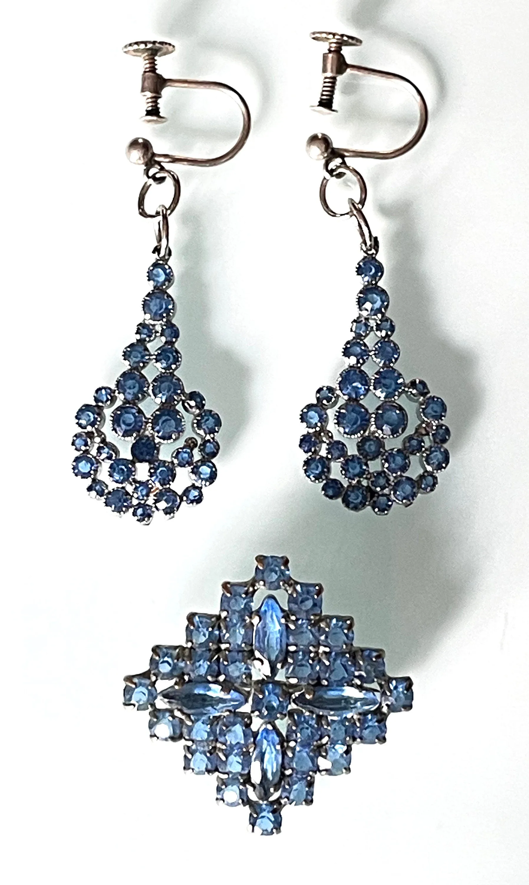 Vintage sapphire blue crystal cluster design brooch and screw back earrings with rhinestones set open-backed in silver tone